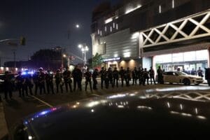 Law enforcement officers stand guard during a protest against federal immigration in downtown Los Angeles, California, on Monday. Aude Guerrucci/Reuters